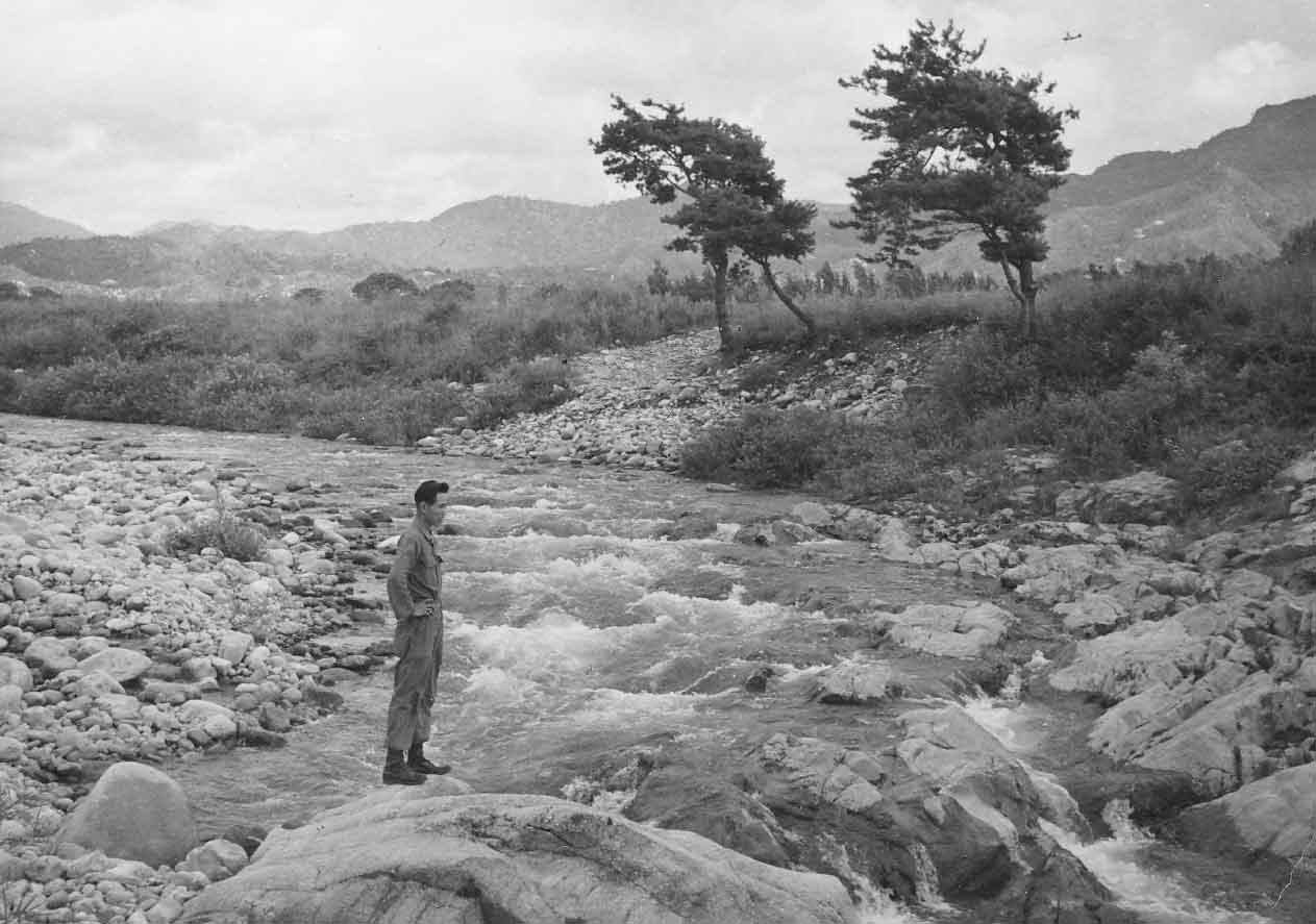 Him Thoon Standing on River in Korea